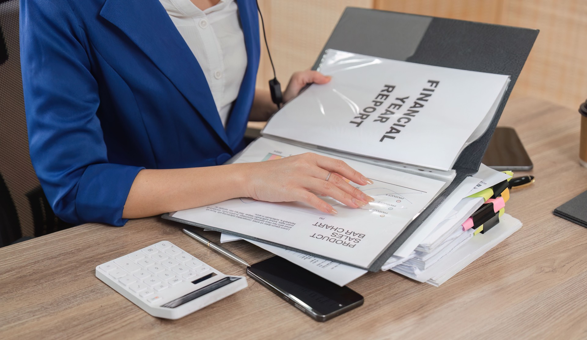 Accountant organizing financial reports and tax documents for clients